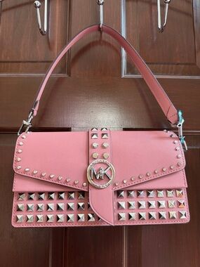 Michael Kors Pink Studded Shoulder Bag with MK Logo Hardware. See photos